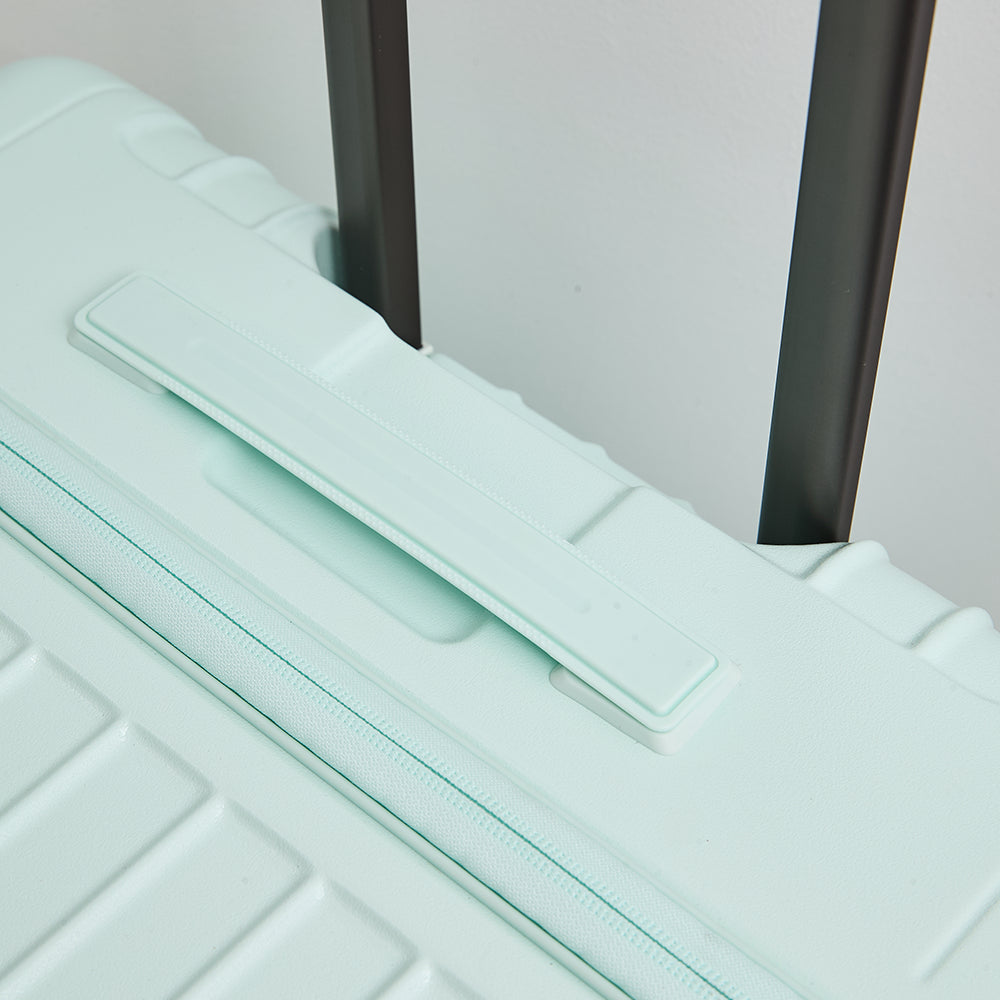 Lovetour light green luggage top handle detail
