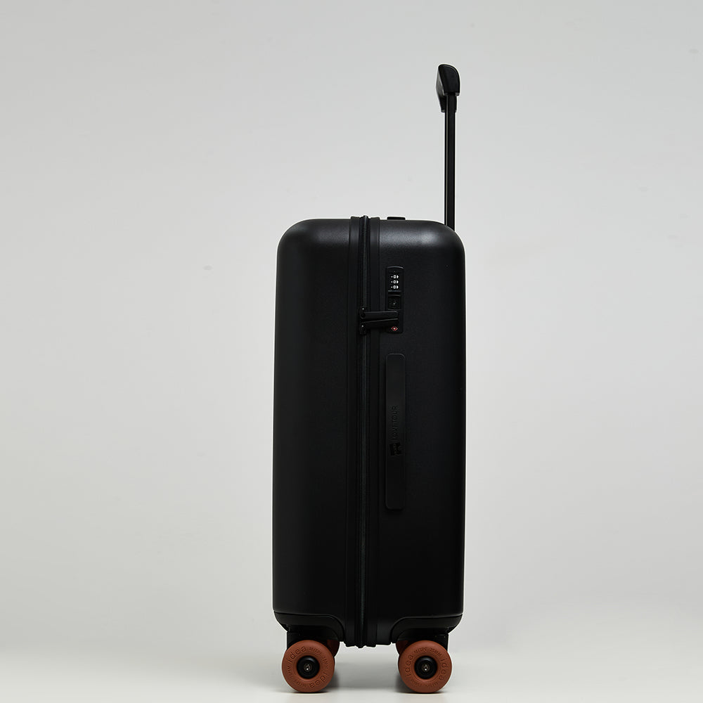 Close-up of Lovetour black suitcase side detail showing built-in combination lock, zipper, and brand logo carry handle