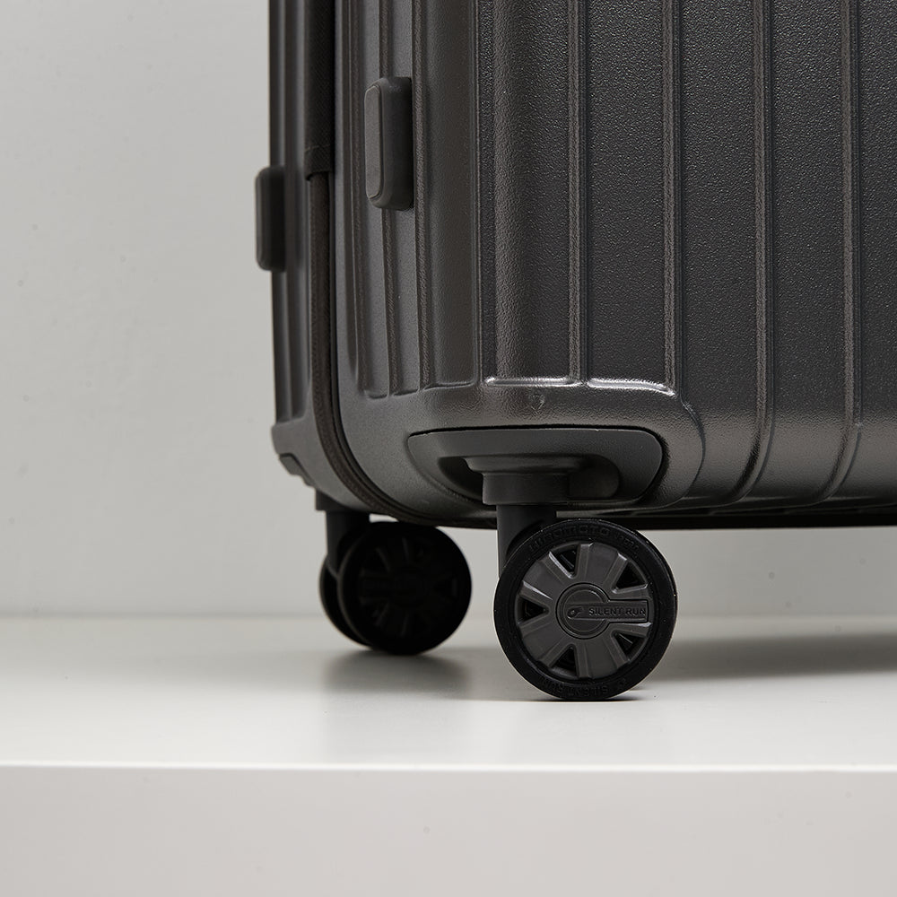 Detailed view of Lovetour luggage silent run 360-degree spinner wheel with subtle branding